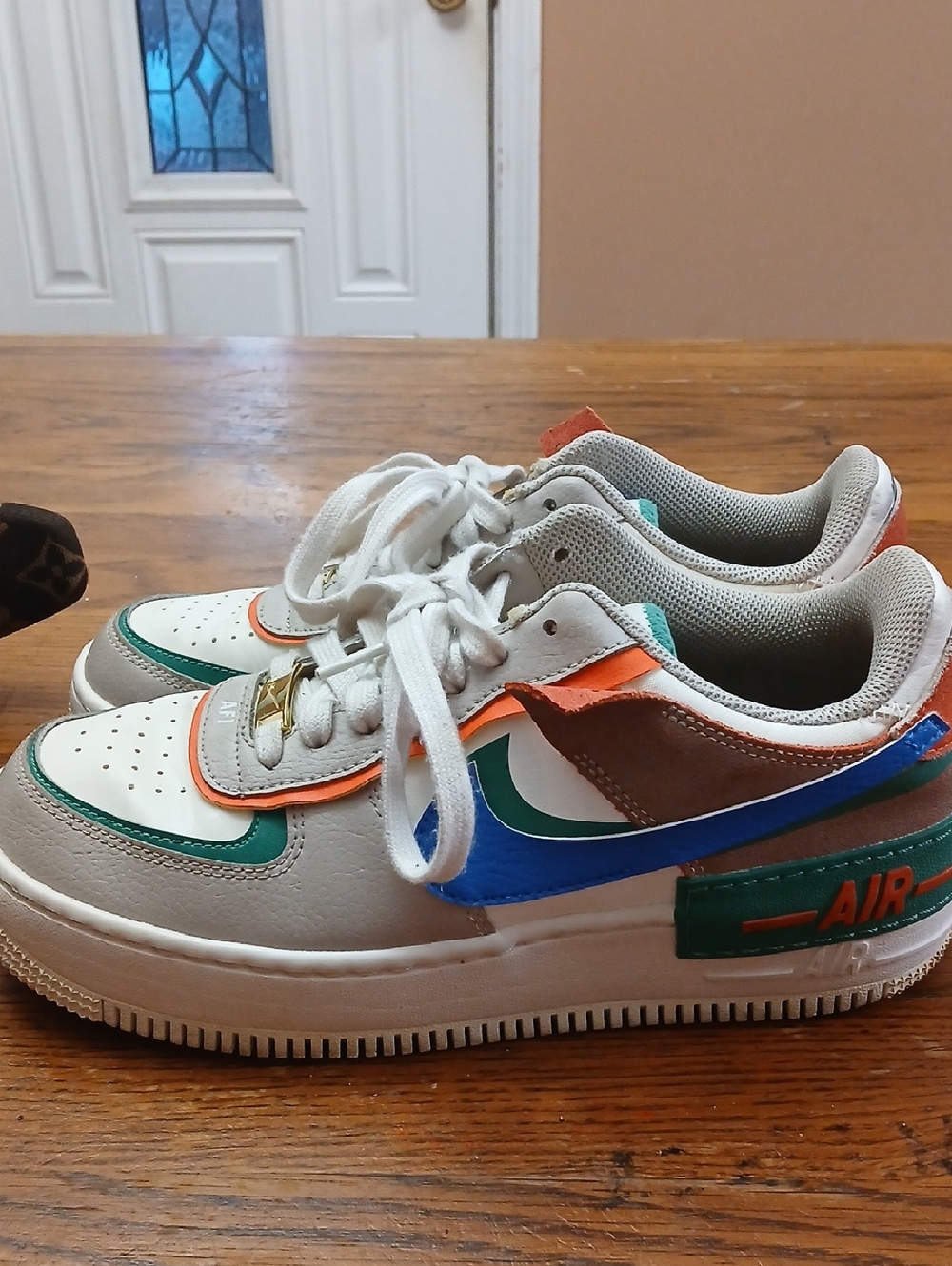Nike Low-Top Sneakers in White with Green, Blue, Orange & Brown Accents